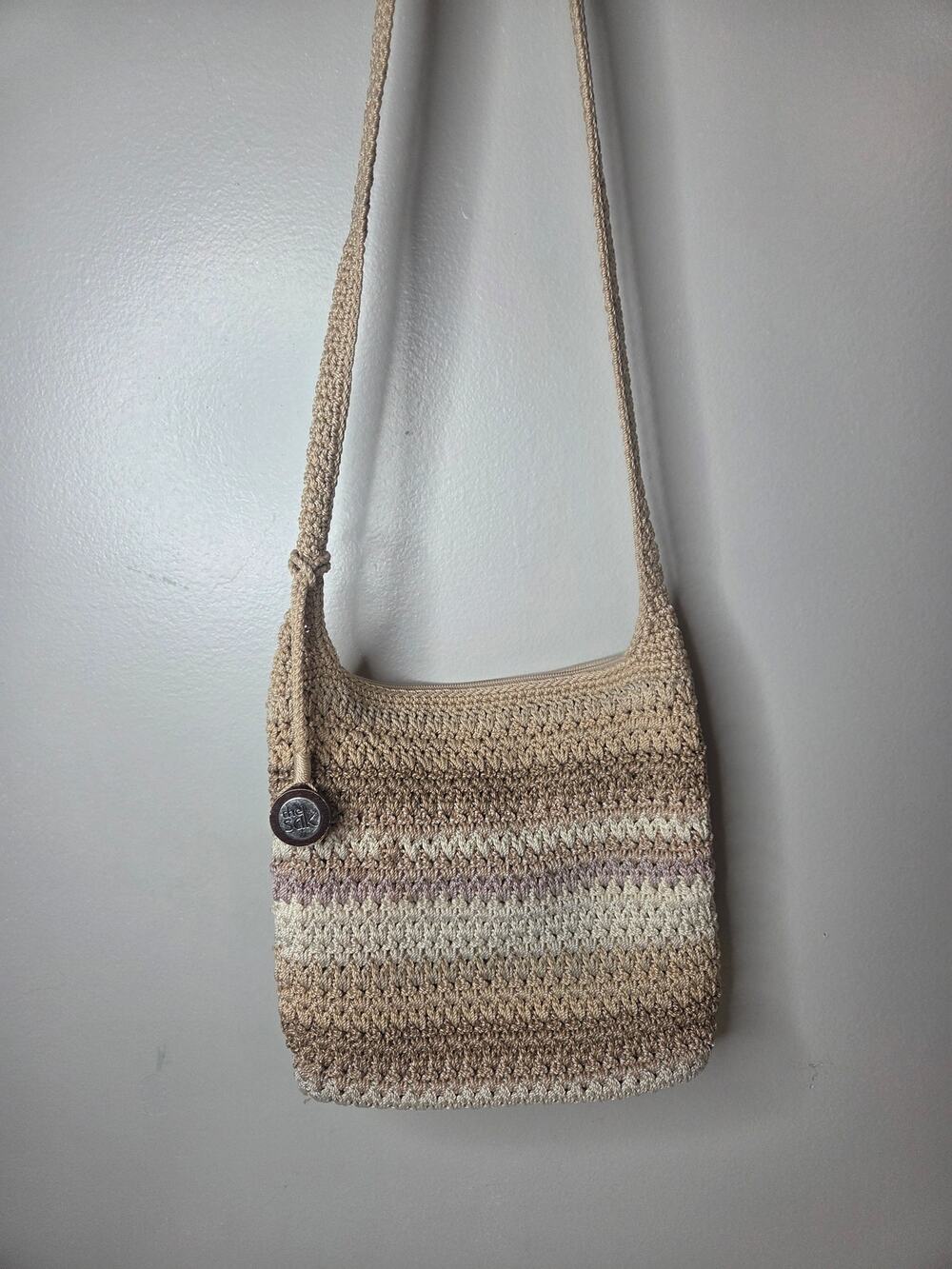 The Sak Crossbody Multi Colored Crochet Handbag Purse with bag charm
